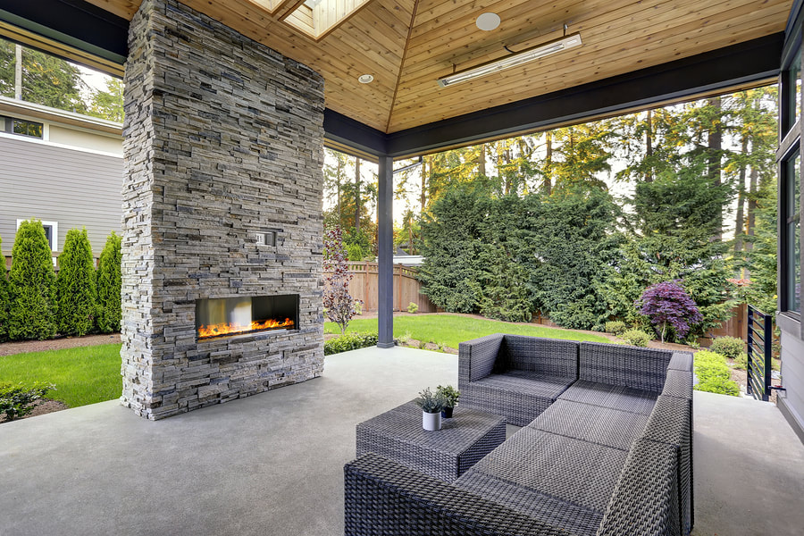 a brick fireplace and gray patios