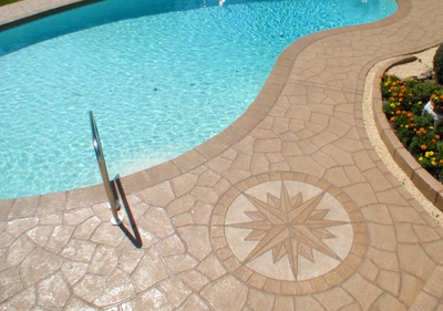 concrete pool deck with circular pattern feature